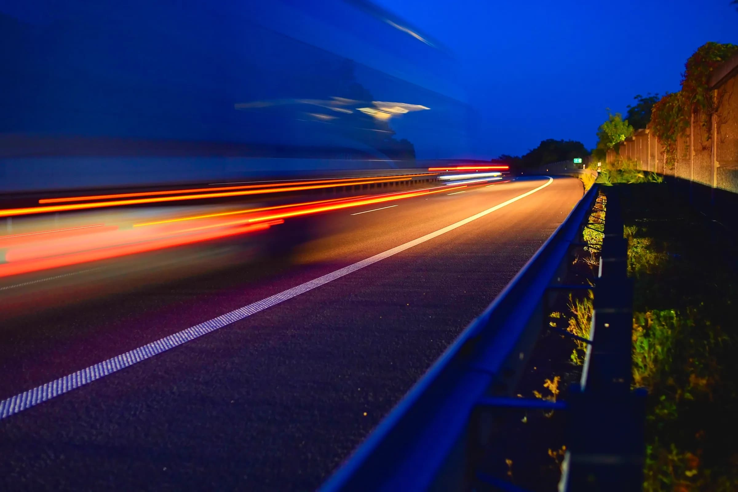 Truck at speed on motorway at dusk